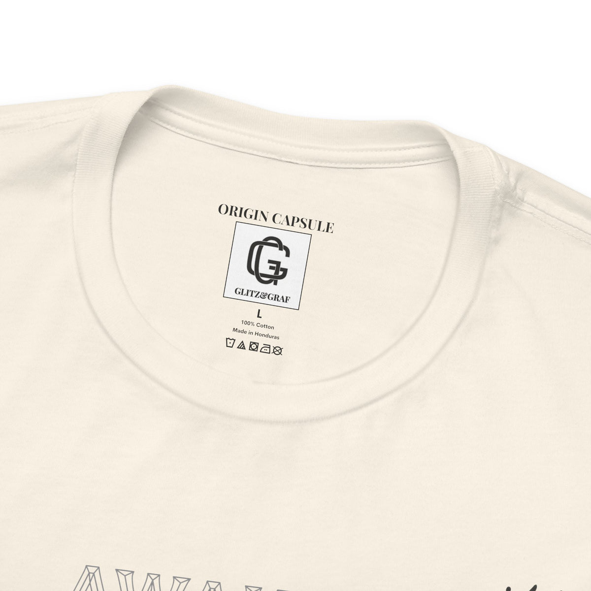 Close-up of a natural color t-shirt with a GLITZ&GRAF brand label on the collar.